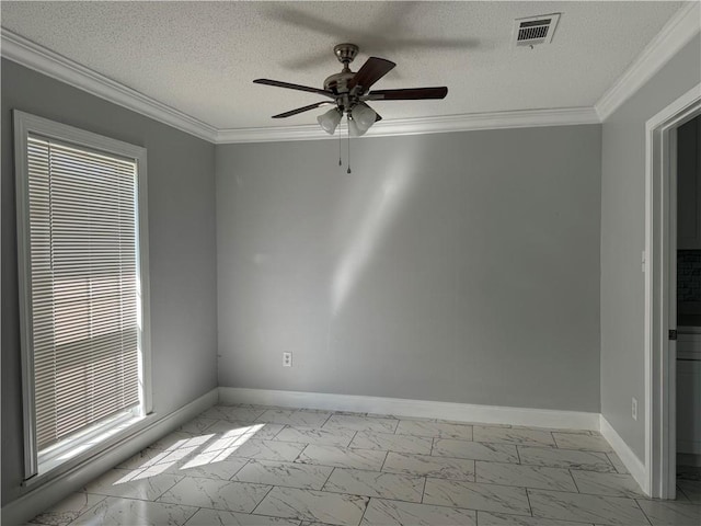 spare room featuring ornamental molding, a textured ceiling, ceiling fan, and light tile floors