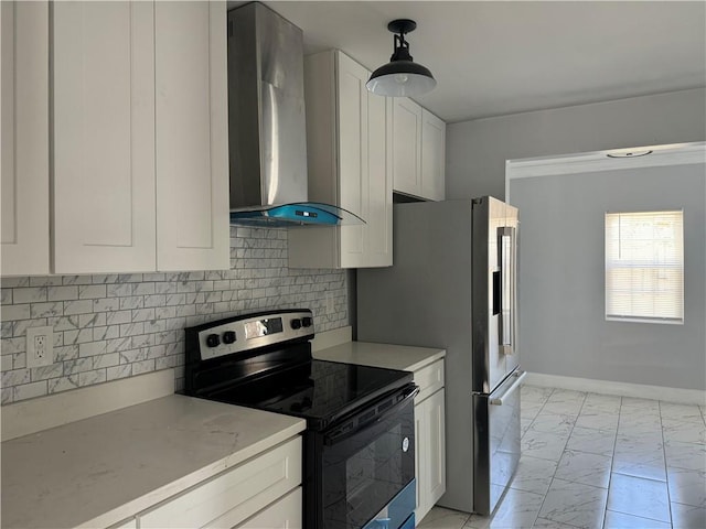 kitchen featuring white cabinets, wall chimney range hood, tasteful backsplash, stainless steel range with electric cooktop, and pendant lighting