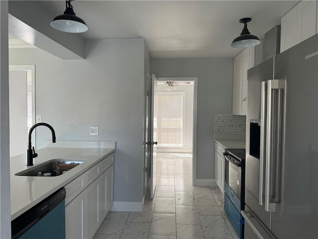 kitchen featuring dishwashing machine, high quality fridge, black range with electric stovetop, white cabinetry, and pendant lighting