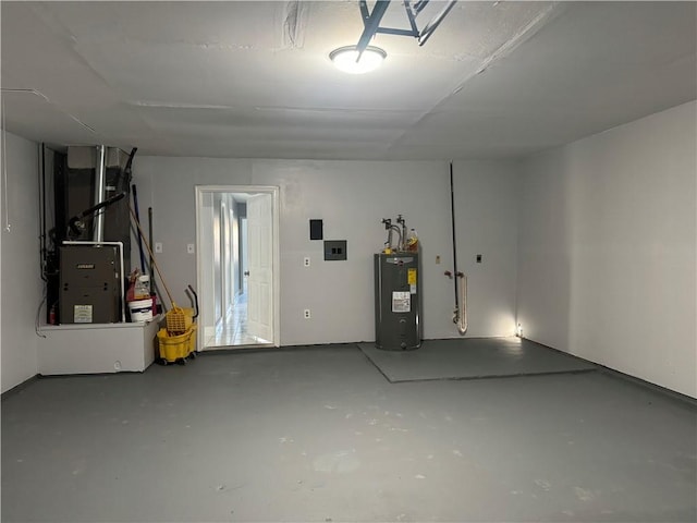 garage with water heater and heating utilities