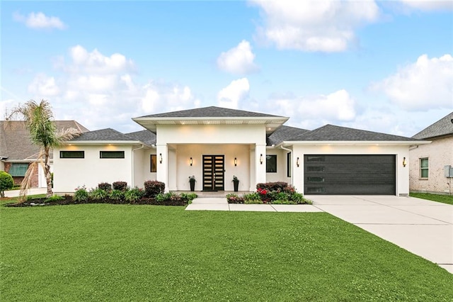 prairie-style home with a garage and a front yard