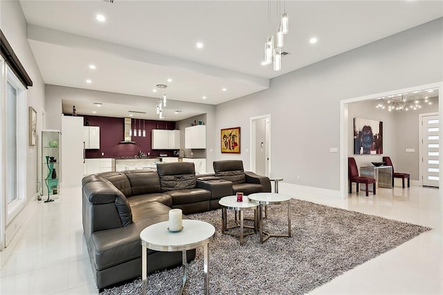 living room with an inviting chandelier and light tile flooring