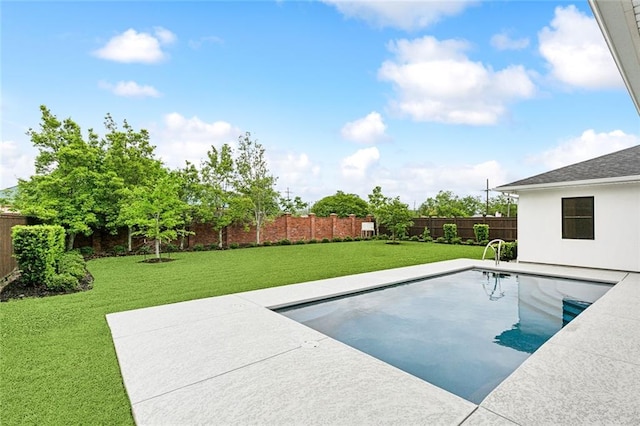 view of pool with a patio and a yard