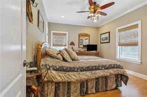 bedroom featuring ceiling fan and hardwood / wood-style flooring