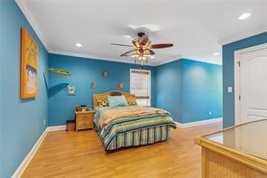 bedroom with hardwood / wood-style floors and ceiling fan