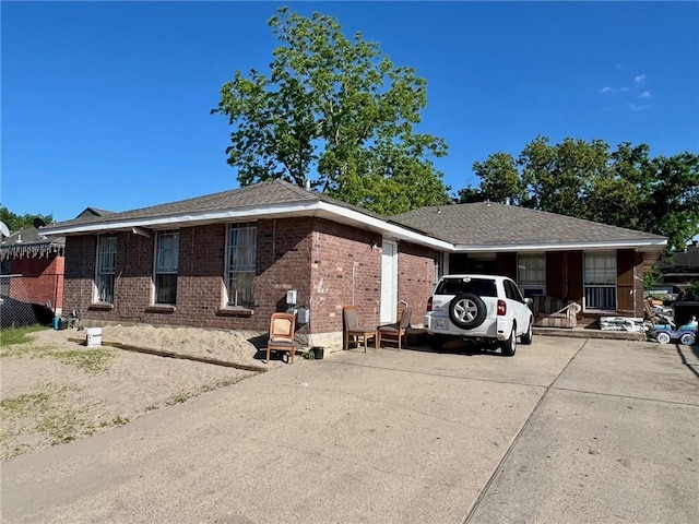 single story home featuring a carport