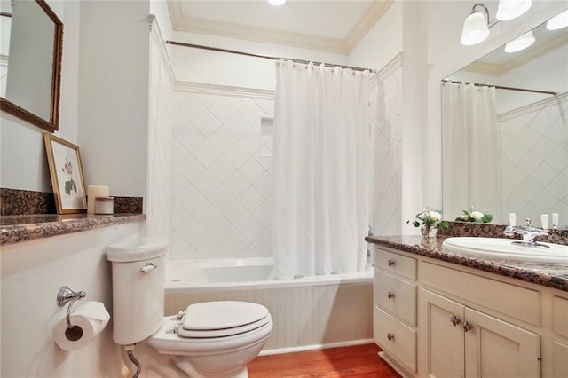 full bathroom featuring vanity, hardwood / wood-style flooring, ornamental molding, shower / bath combo, and toilet