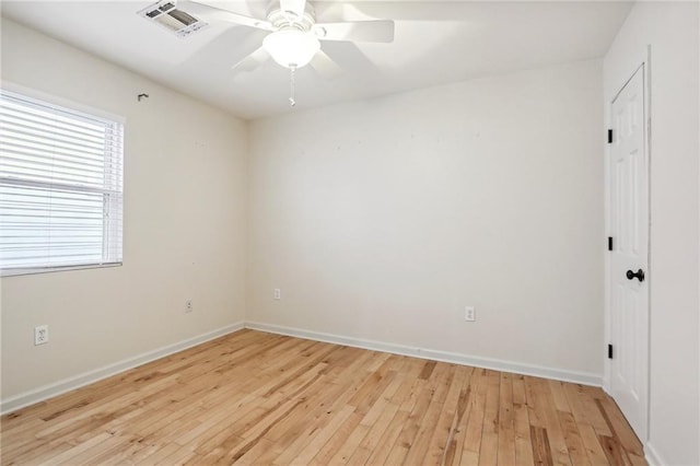 empty room featuring light hardwood / wood-style flooring and ceiling fan