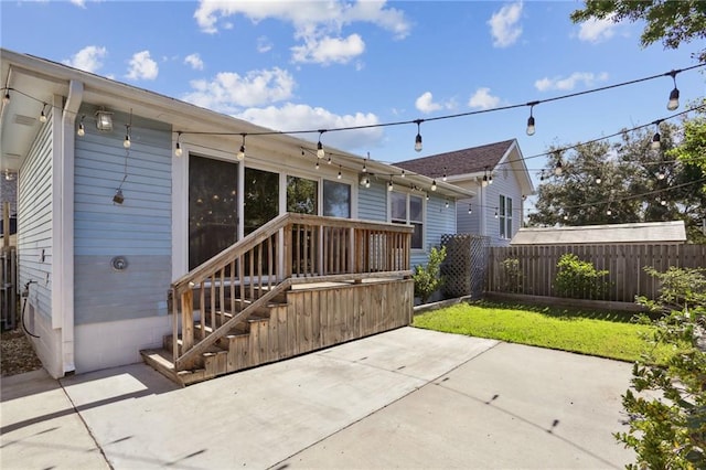 back of property featuring a lawn and a patio area