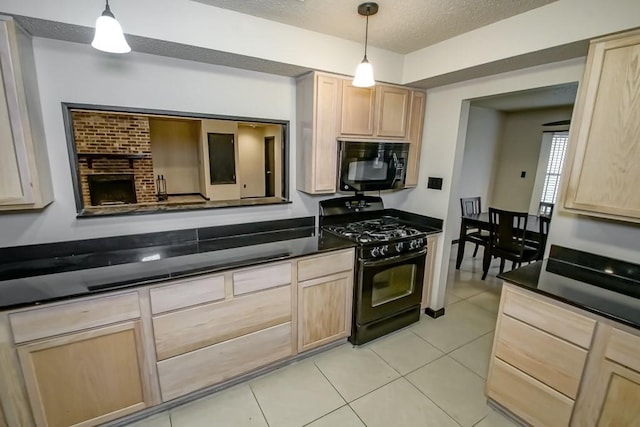 kitchen with light brown cabinets, black appliances, light tile patterned flooring, and pendant lighting