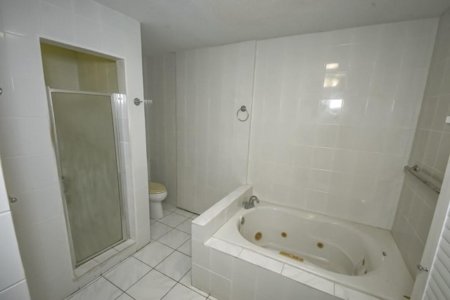 bathroom featuring tile patterned flooring, toilet, and separate shower and tub