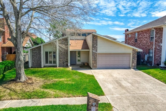 view of front of home with a garage and a front yard