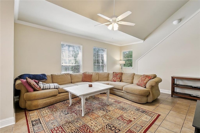 living area featuring light tile patterned flooring, crown molding, baseboards, and ceiling fan