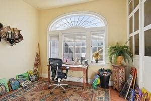 office area with a healthy amount of sunlight and wood-type flooring