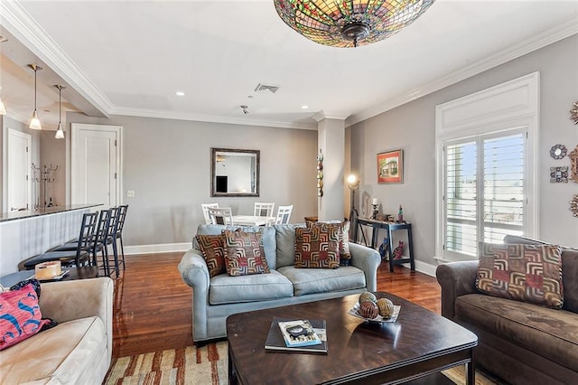 living room with dark hardwood / wood-style floors and crown molding