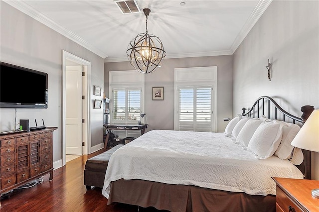 bedroom featuring a chandelier, hardwood / wood-style flooring, and crown molding