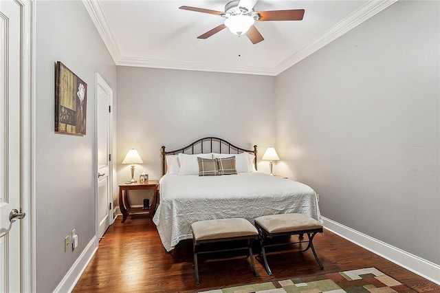 bedroom with dark hardwood / wood-style floors, ceiling fan, and crown molding