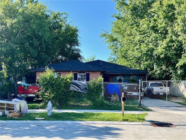 view of front of property featuring a carport