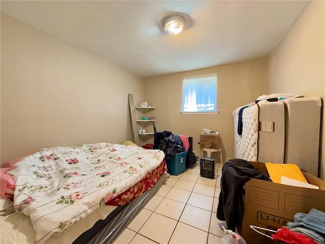 bedroom featuring light tile patterned floors