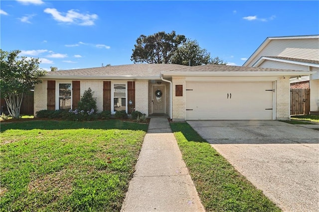 single story home featuring a garage and a front yard