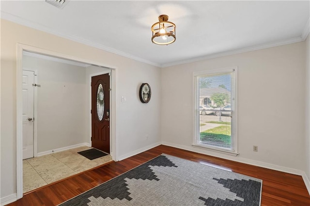 foyer entrance featuring hardwood / wood-style flooring and ornamental molding