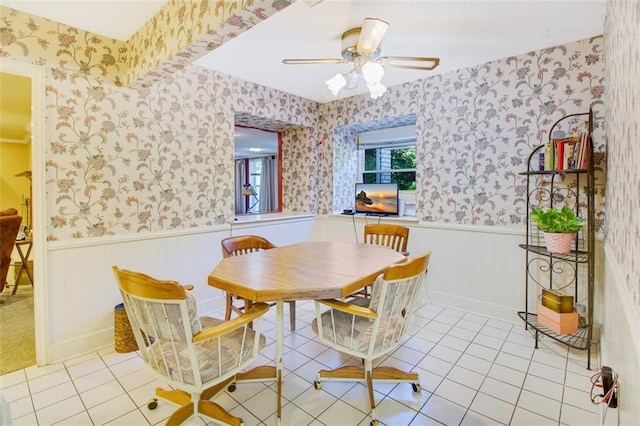 dining area featuring ceiling fan and light tile flooring