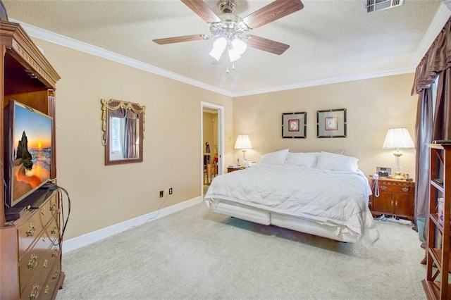 bedroom featuring ornamental molding, carpet flooring, and ceiling fan