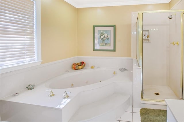 bathroom with independent shower and bath, vanity, and tile floors