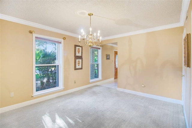 carpeted empty room featuring a wealth of natural light, an inviting chandelier, and ornamental molding