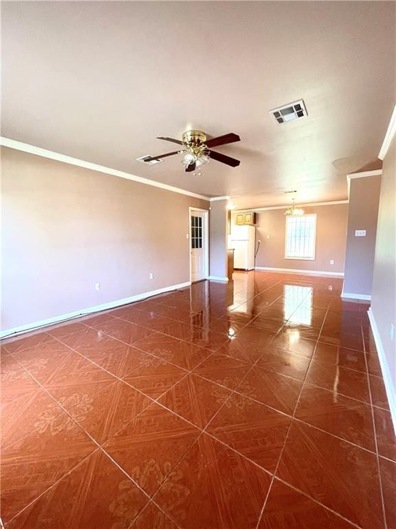 tiled empty room with ornamental molding and ceiling fan