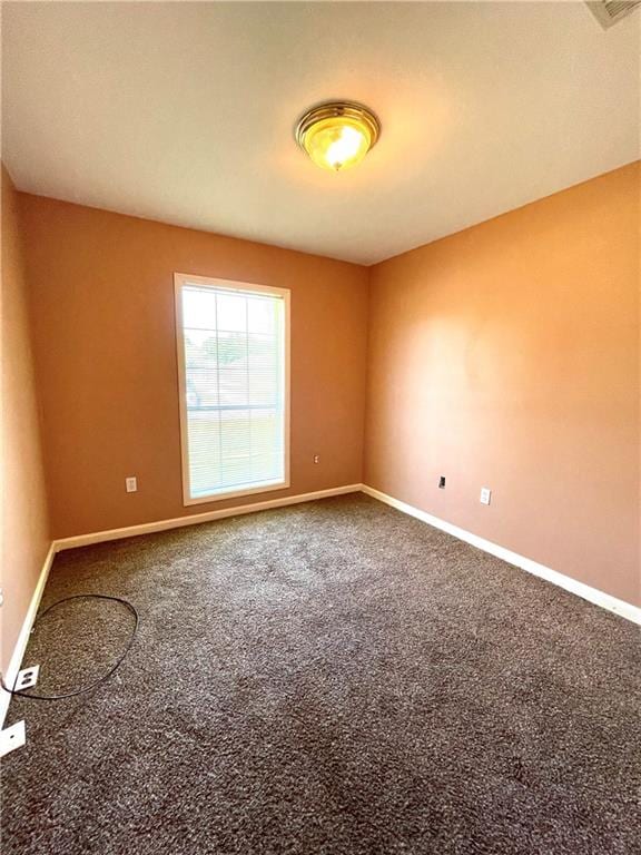 empty room featuring carpet flooring