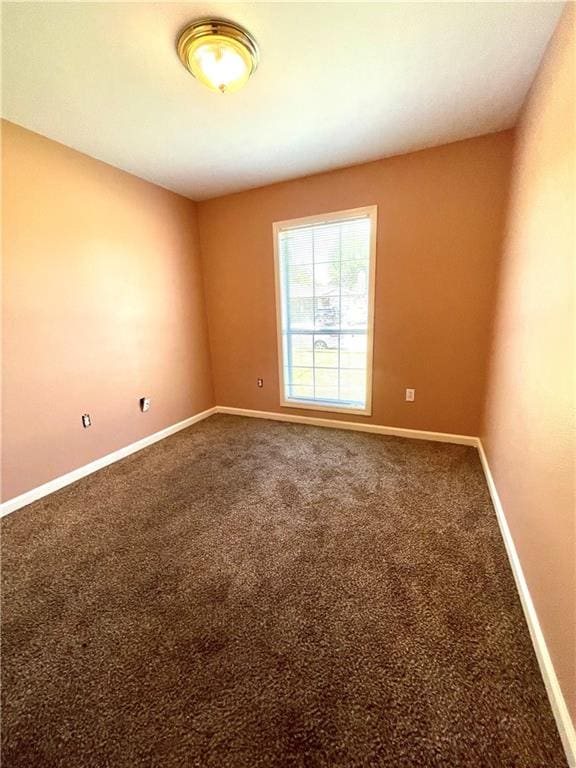 unfurnished room with carpet floors