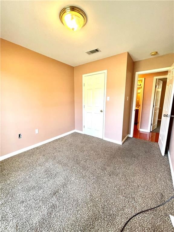 unfurnished bedroom with carpet flooring