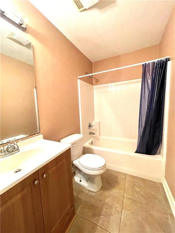 full bathroom with tile flooring, vanity, toilet, and shower / tub combo with curtain