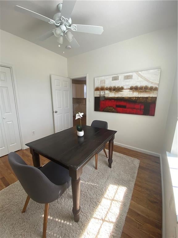 home office with wood-type flooring and ceiling fan