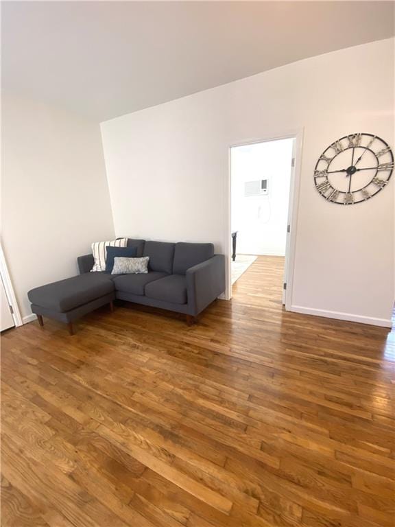 unfurnished living room with dark hardwood / wood-style flooring