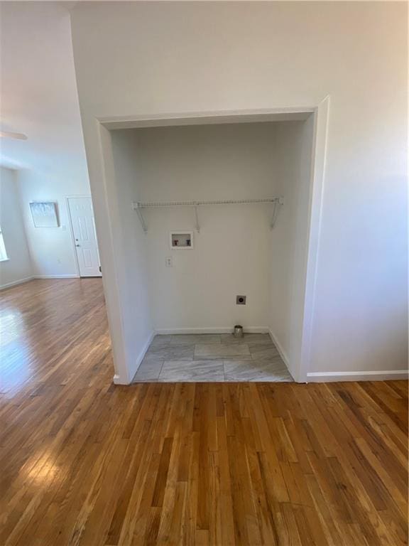 laundry area featuring washer hookup and hardwood / wood-style floors