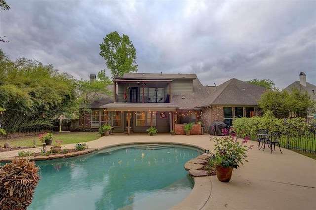 view of pool featuring a patio area