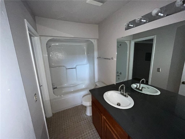 full bathroom with a textured ceiling, oversized vanity, shower / bathing tub combination, tile floors, and toilet