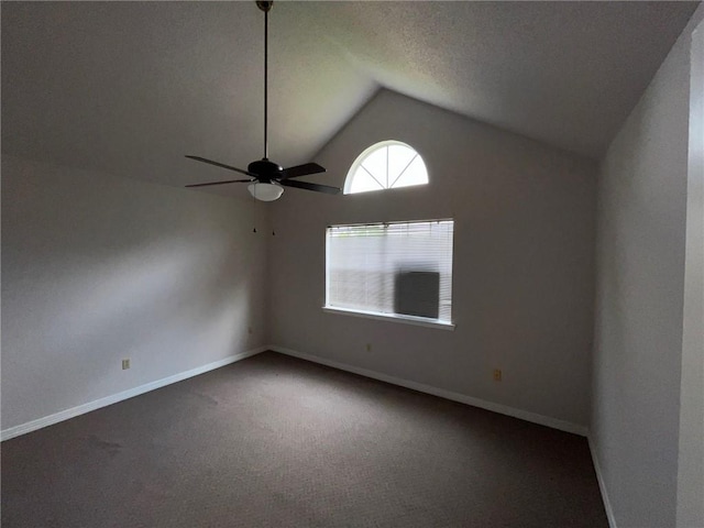 unfurnished room featuring carpet floors, a textured ceiling, ceiling fan, and vaulted ceiling