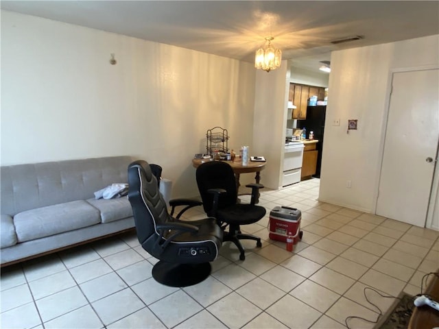 tiled living room featuring a chandelier