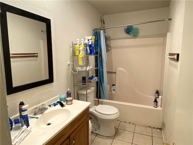 full bathroom with vanity with extensive cabinet space, toilet, shower / bath combo, and tile flooring