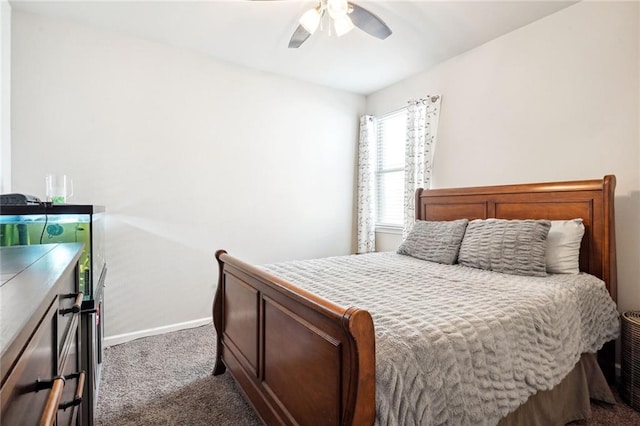 bedroom featuring ceiling fan and dark colored carpet