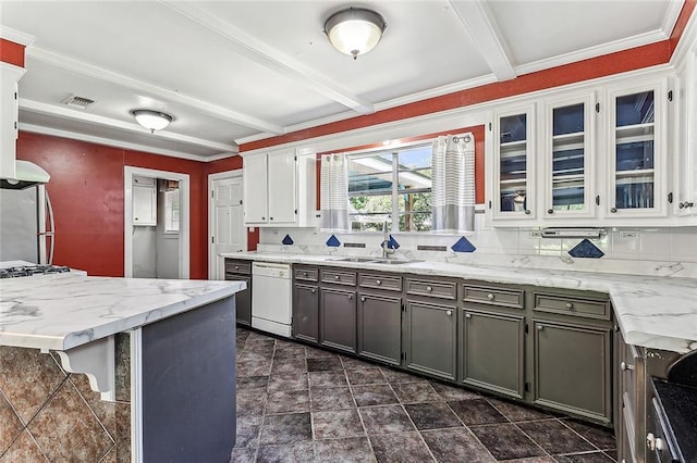 kitchen with white cabinets, sink, dishwasher, dark tile flooring, and beam ceiling