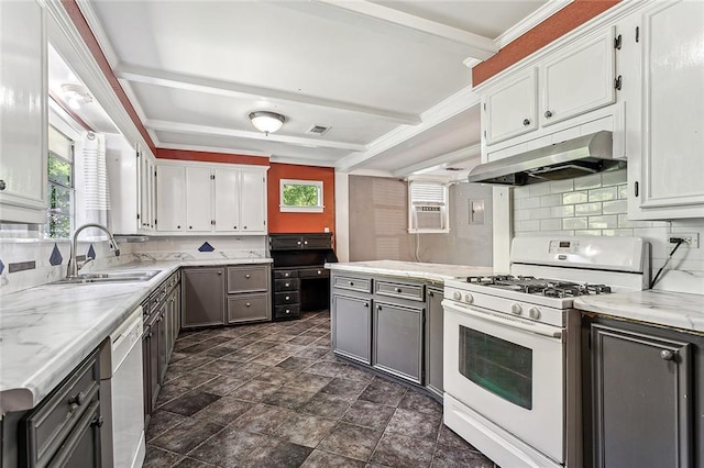 kitchen with white appliances, crown molding, tasteful backsplash, sink, and dark tile floors