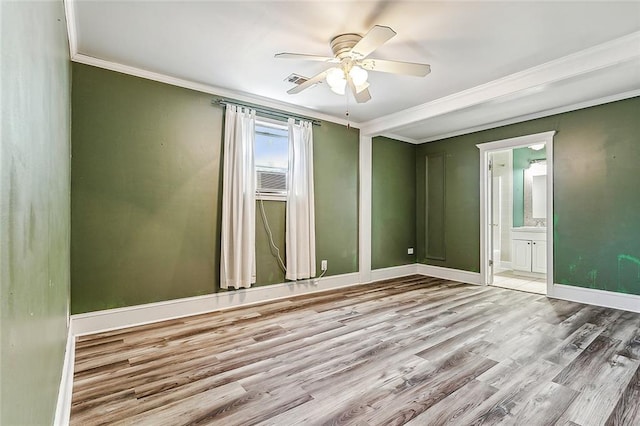 empty room with hardwood / wood-style floors, ceiling fan, and crown molding