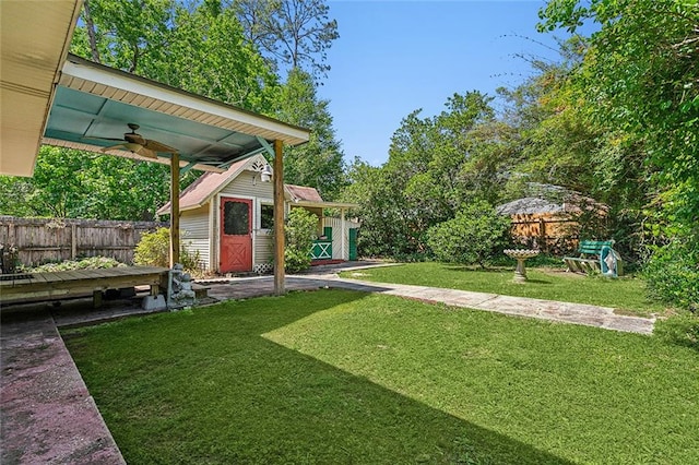 view of yard with ceiling fan