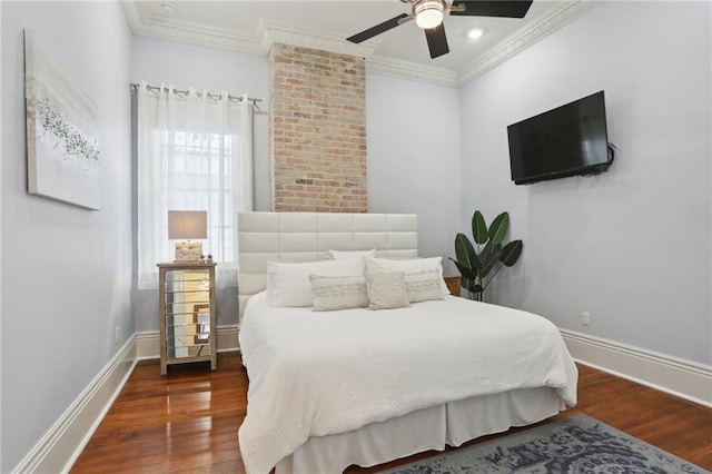 bedroom with ornamental molding, dark hardwood / wood-style flooring, and ceiling fan