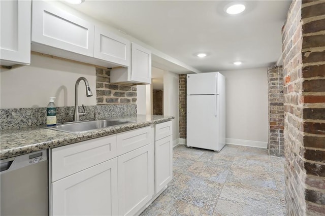 kitchen featuring light tile floors, sink, dishwasher, white cabinetry, and white refrigerator