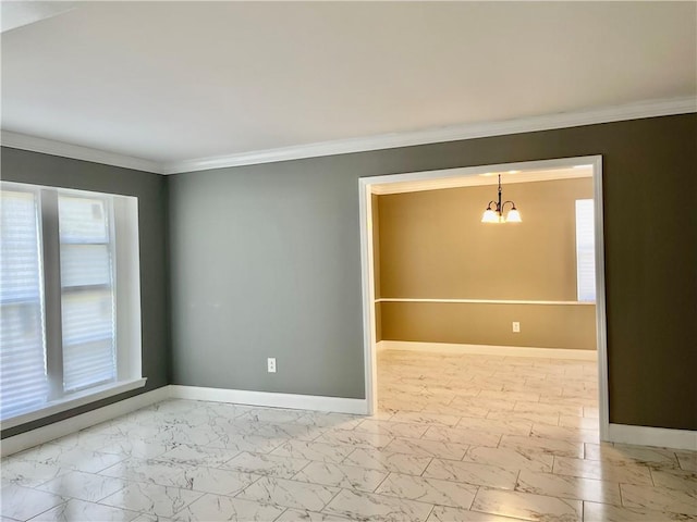 spare room featuring an inviting chandelier and ornamental molding